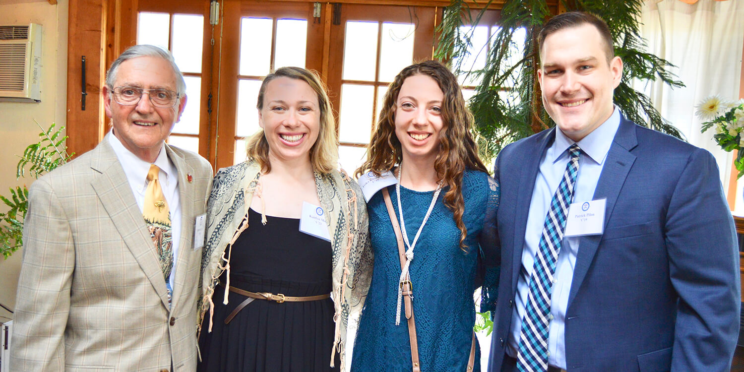 Dr. James Stewart poses with students Kaitlyn Moss, Erika Klemp, and Patrick Pilon at the Opportunity Scholarship reception