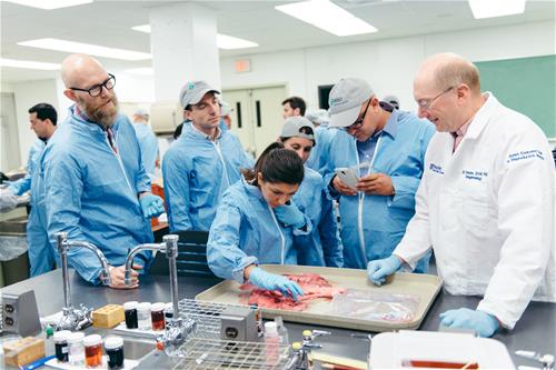 Penn Vet's Dr. Gary Althouse training Merck managers in swine reproduction.
