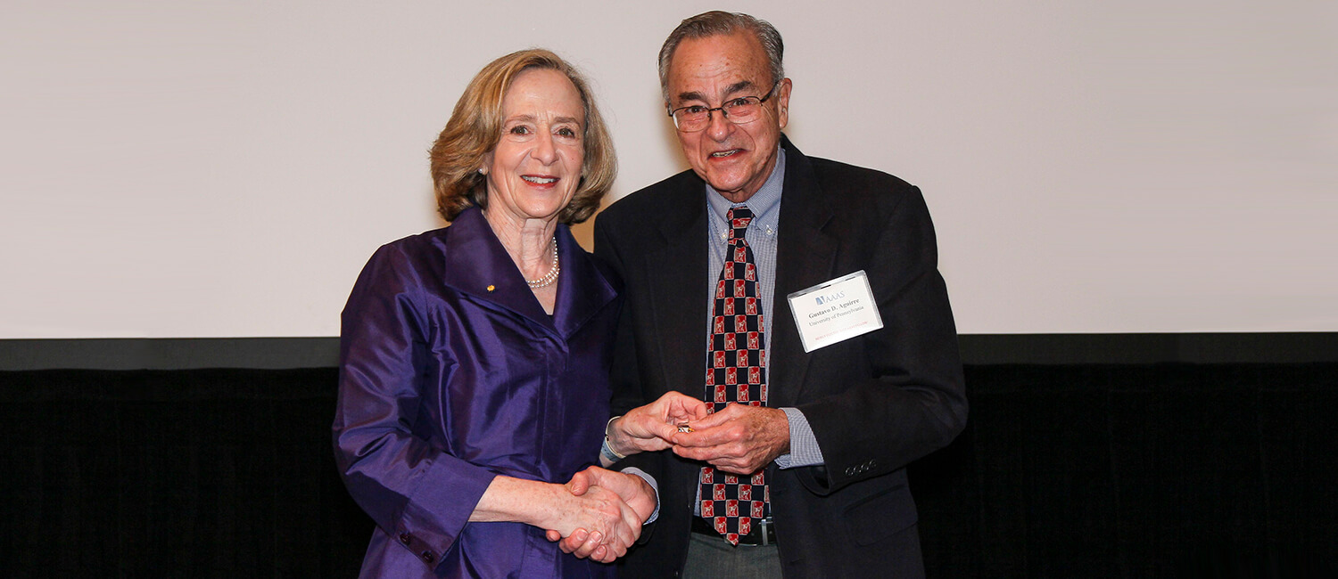 Dr. Gustavo Aguirre at the 2018 Fellows Forum receiving his award from Dr. Susan Hockfield, AAAS President. Photo courtesy of AAAS.