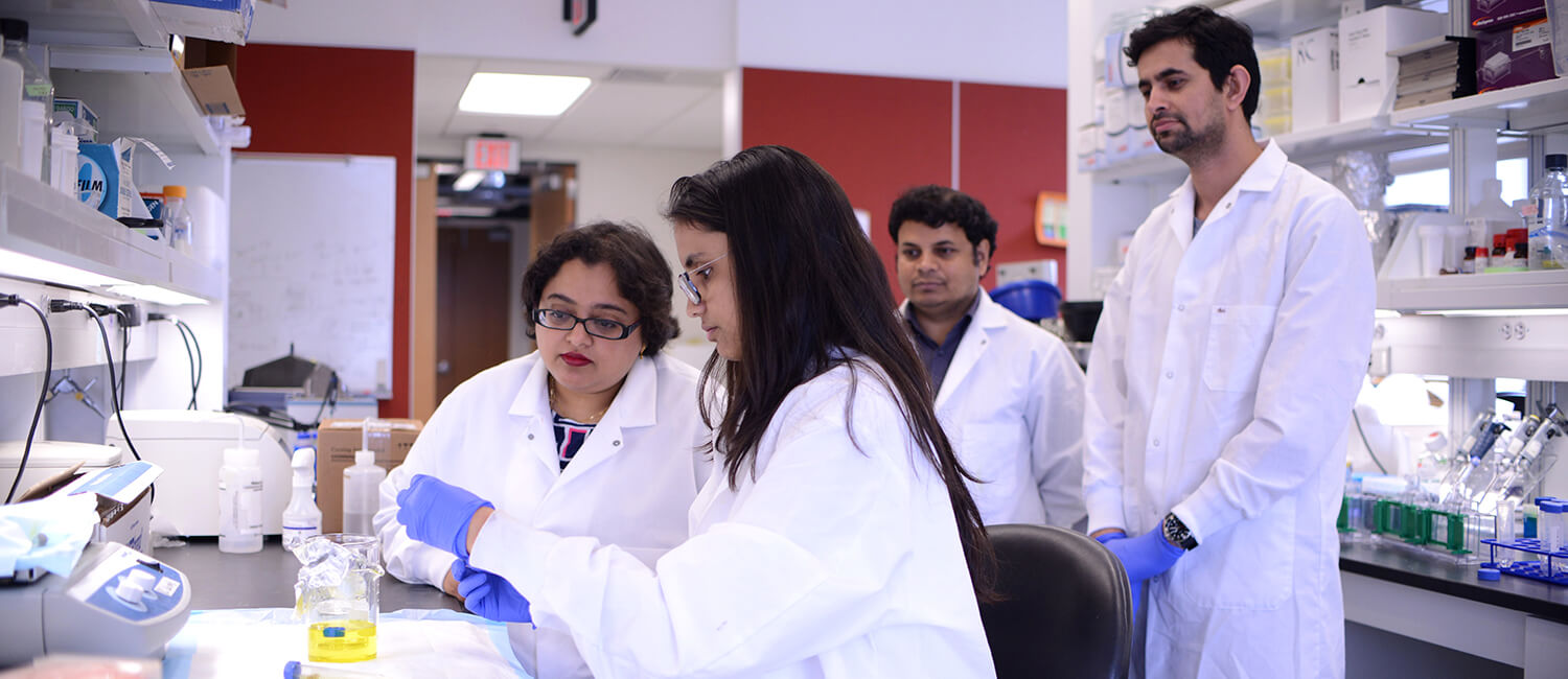 Dr. Rumela Chakrabarti (left) with her lab, including Sushil Kumar (far right).