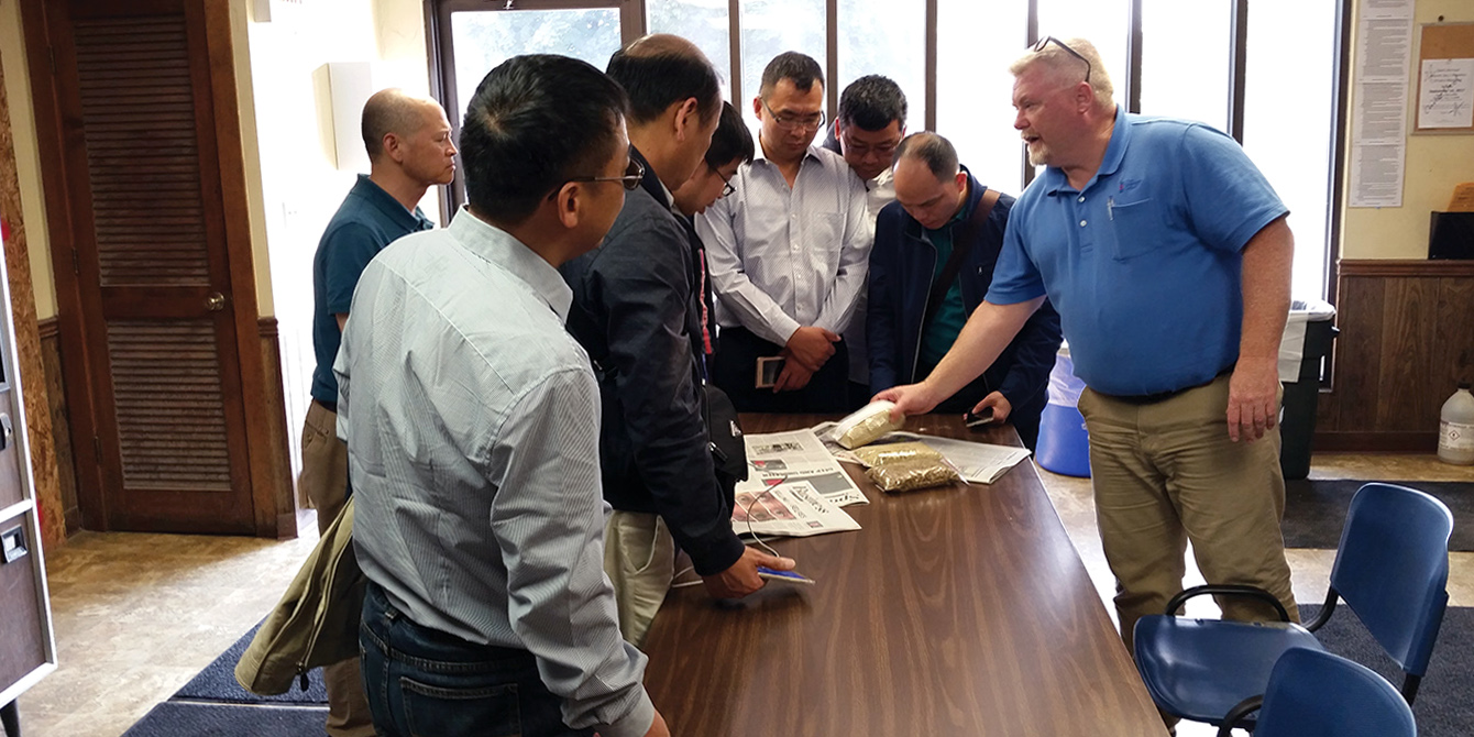 Chinese swine producers learn about quality control programs at Wenger Feeds in Rheems, Pa., as part of their visit with Penn Vet faculty.