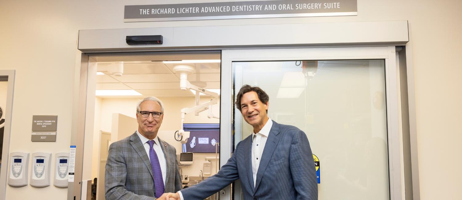 Andrew Hoffman shaking hands with Richard Lichter