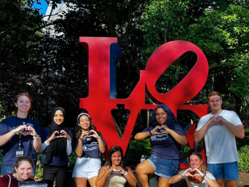 Students in Front of Love Statue