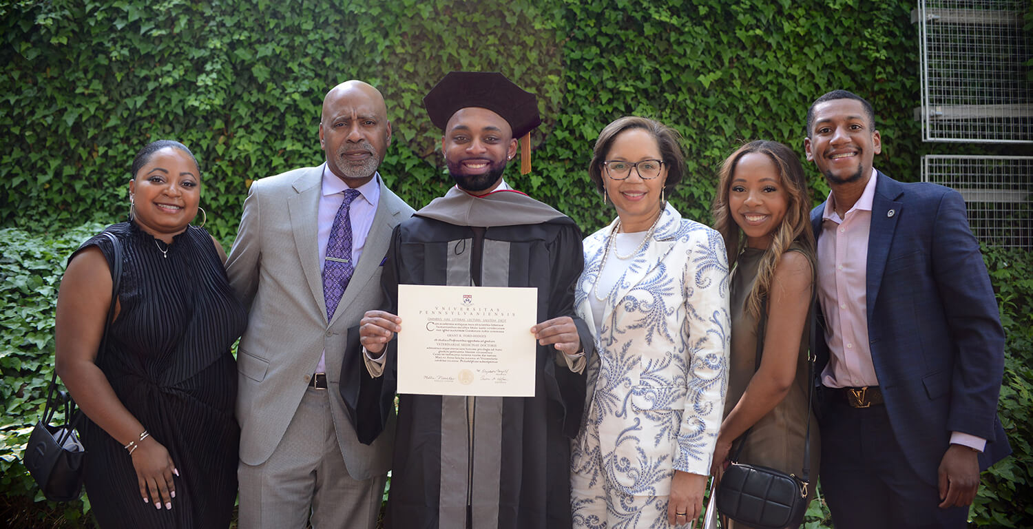 Photo of graduate with his family