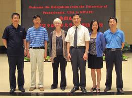 Dean Joan Hendricks and Dr. Zhengxia Dou with University officials.
