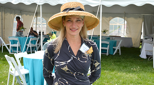 Janet Mioduszewski, client services manager at New Bolton, greets guests at the hospitality tent.