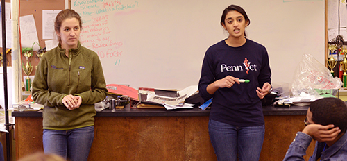 Meghana Pendurthi, at right, with her classmate, Ashley Cherry, speak with students at the W.B. Saul High School of Agricultural Sciences about sustainable agriculture in urban spaces.