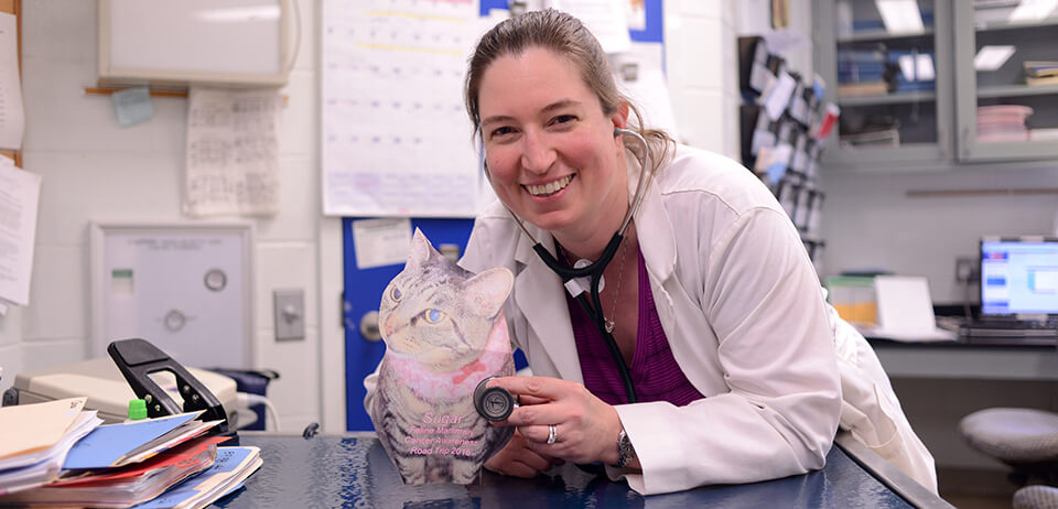 Dr. Erika Krick poses with “Flat Sugar,” which has helped the message of Sugar Rub go viral around the world.