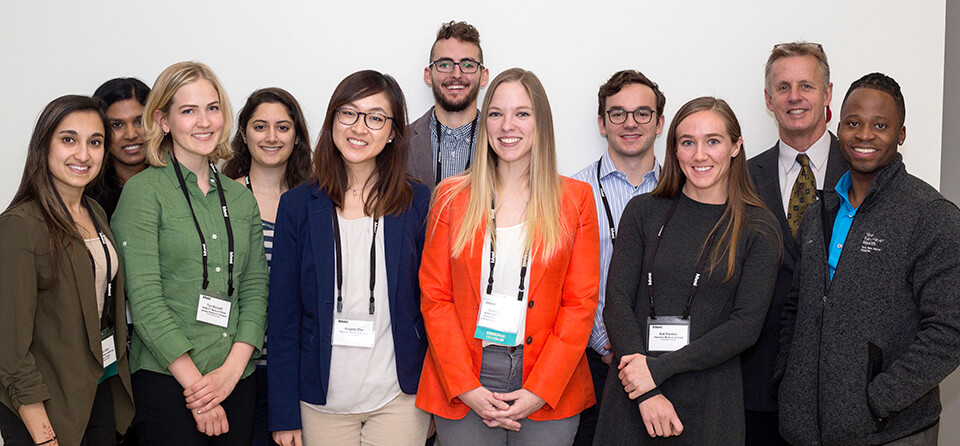 Sabina Hlavaty (in orange jacket) and other students at the 2018 HHMI Medical Fellows Northeast Regional Meeting. Dr. David Holt is second from right.