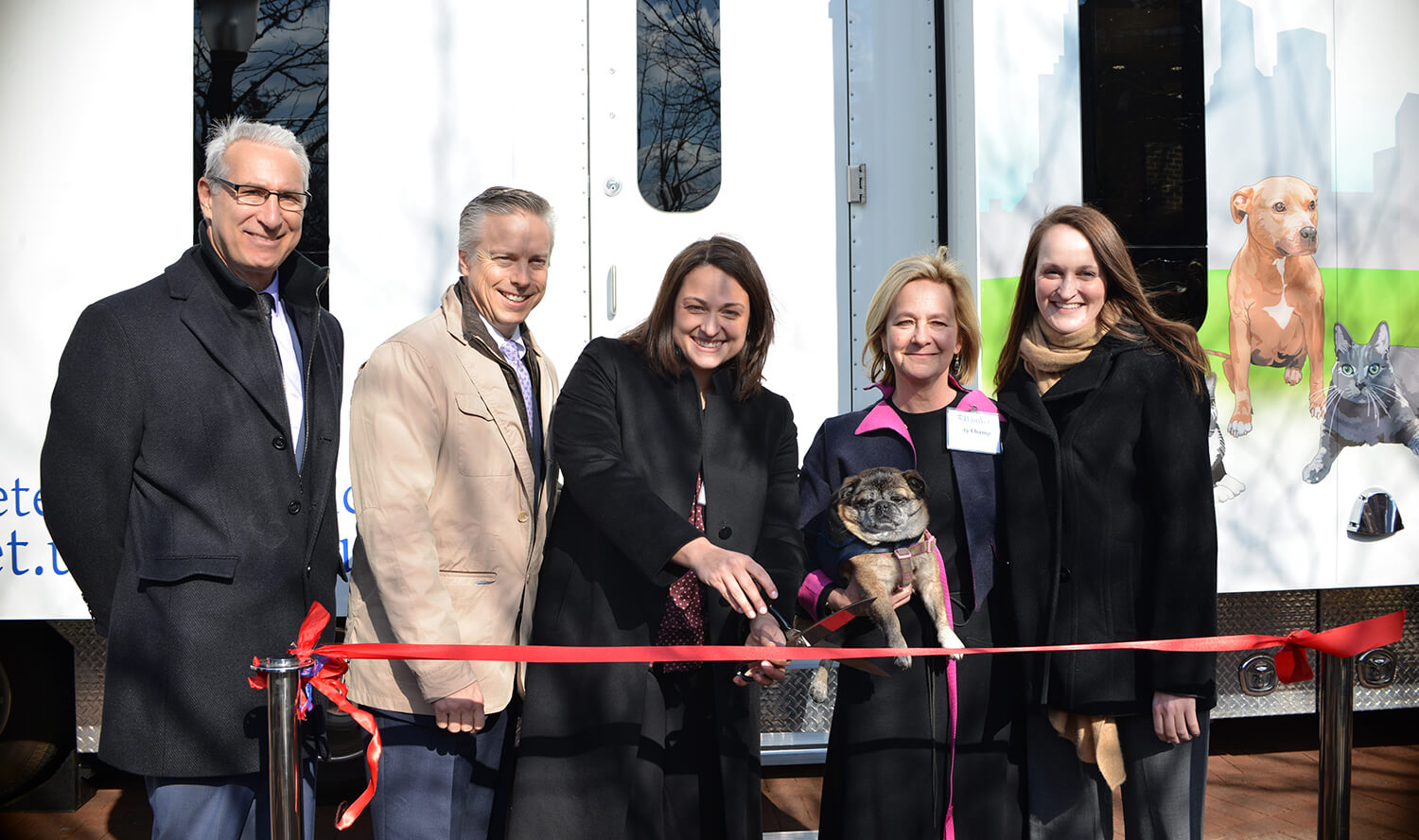 Penn Vet Dean Andrew Hoffman; Dr. David Haworth, PetSmart Charities; Dr. Brittany Watson; Ms. Katy Champ, Bernice Barbour Foundation; and Dr. Chelsea Reinhard cut the ribbon at the mobile clinic unveiling.
