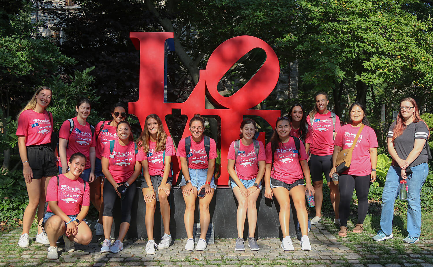 Members of V'25 visit the LOVE sculpture during their tour of Penn's campus.