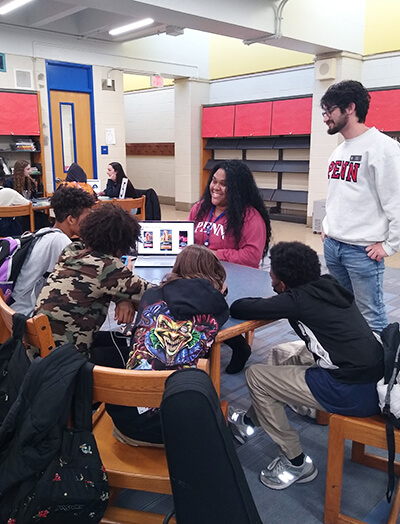 Photo of Penn Vet students working with junior high students