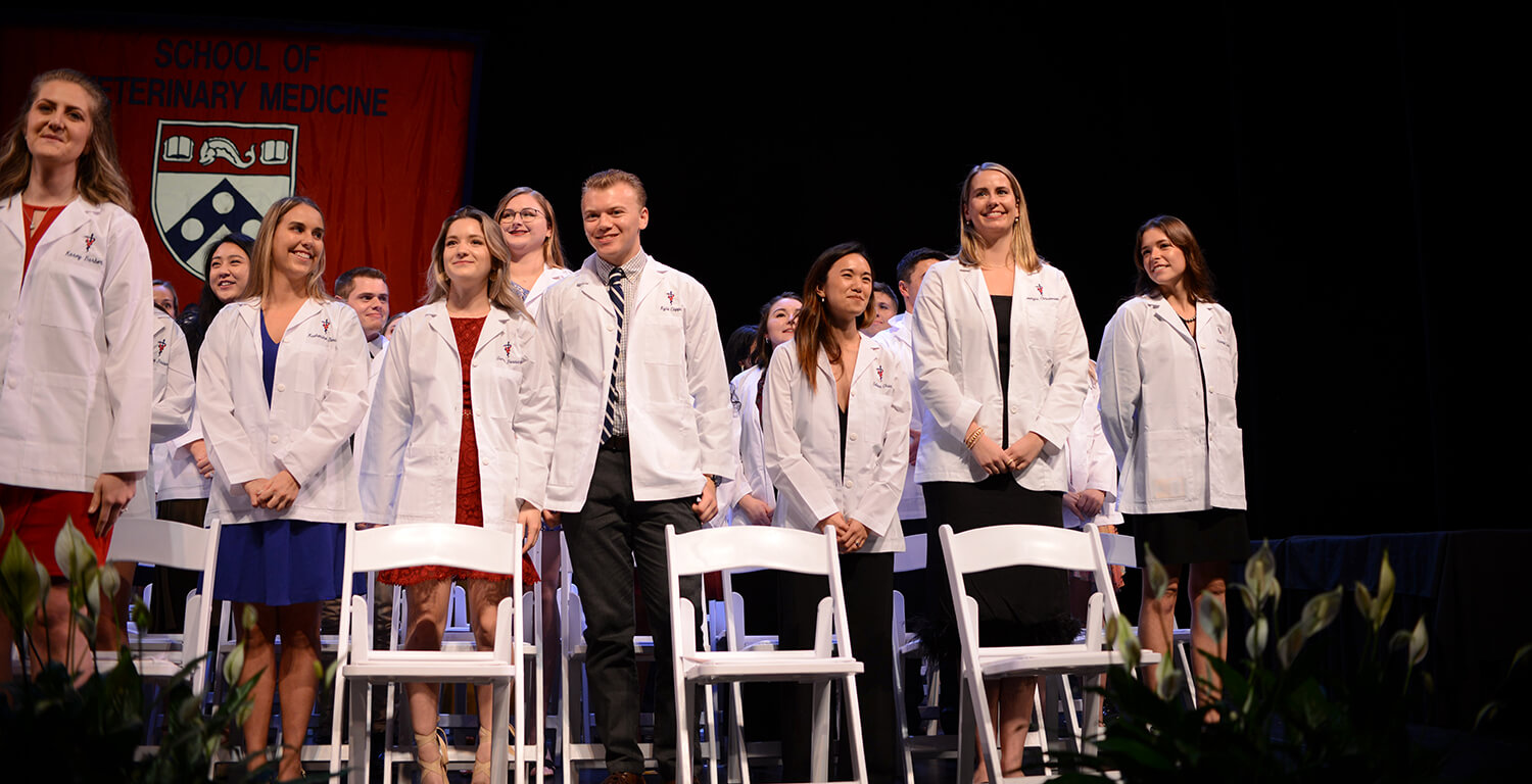 Photo of students wearing their white coats