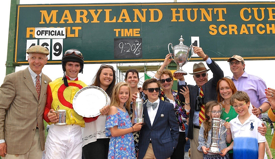 After the 2018 Maryland Hunt Cup win: L-R, Joe Davies, Eric Poretz, Sabrina Moore, Blythe Miller Davies with children Scarlet and Teddy, Vicki and Skip Crawford, Camille Crawford Finley and Fritz Finley with Graeme and Vivien. Photo taken by Robert Keller.
