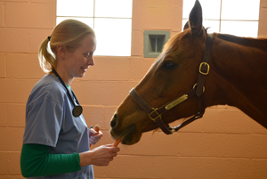 Dr. Michelle Abraham and My Special Girl bond over a carrot.