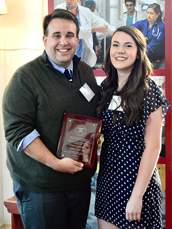 Dr. Stephen Cole, V’15, was honored with the 2018 Charles W. Raker Opportunity Scholarship Award, presented to him by Rachel Durrwachter, V'20, pictured at right. 
