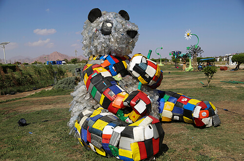 Photo of art installation of panda bear made from plastic waste
