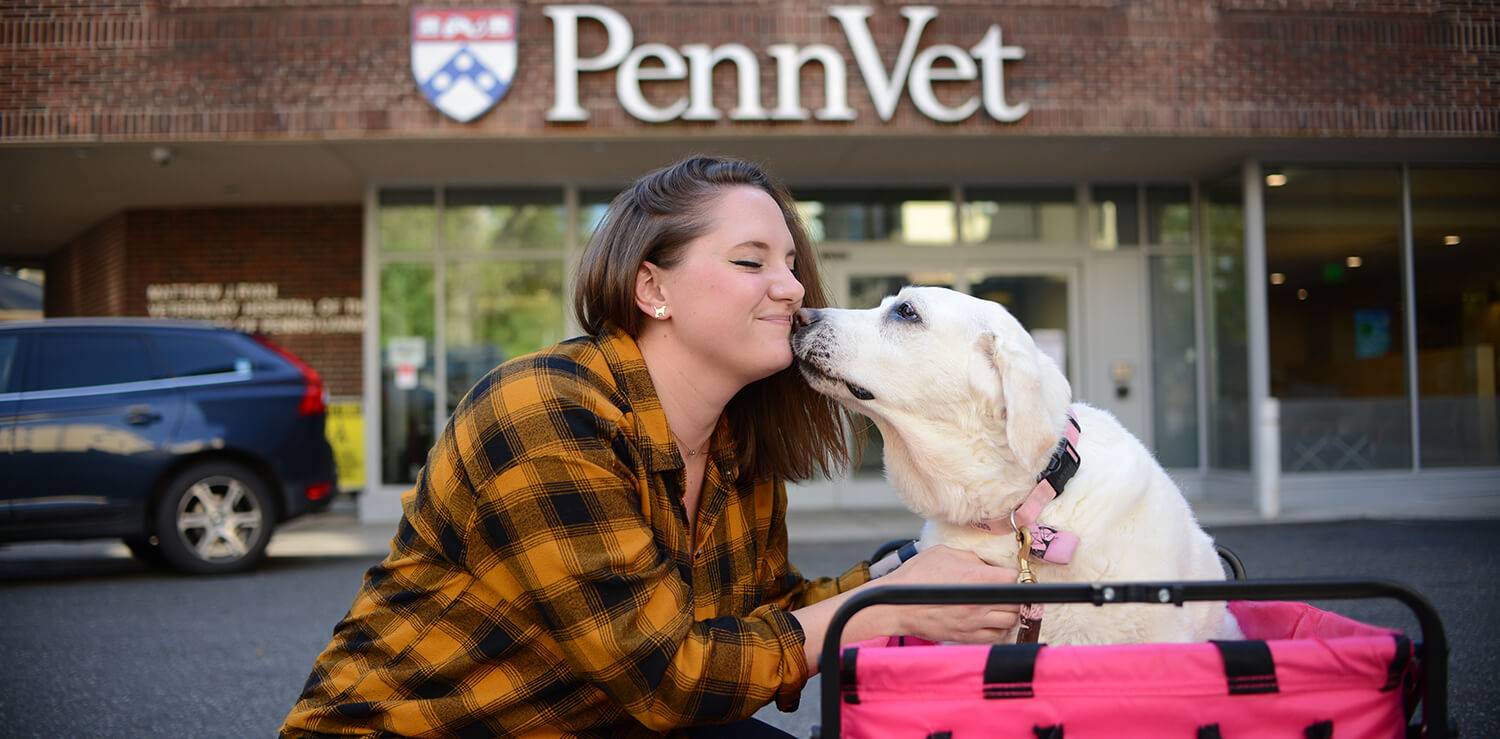 Dr. Meg Ruller receives a kiss from her dog Maple