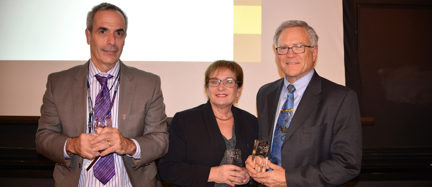 From left, Dr. Elliot V. Hersh, Dr. Rosemary Polomano, and Dr. John T. Farrar receive the 2016 One Health Award