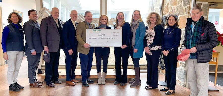 Members of the Pennsylvania Horse Breeders Association present a check to Dr. Mary Robinson (right of center) and other faculty at New Bolton Center.