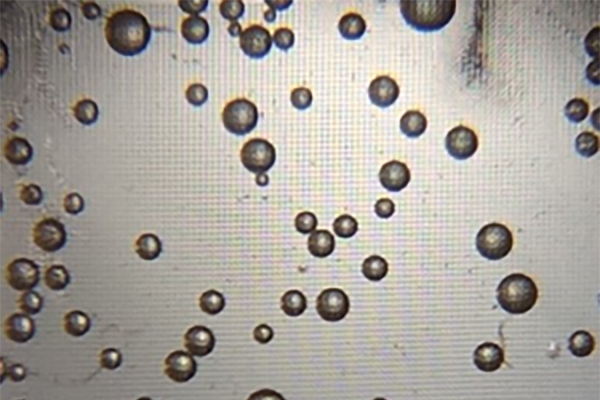 Microbubbles form as a reaction to the bonding of hydrogen peroxide, platinum nanoparticles, and the SARS-CoV-2 antigen, indicating a test result that is positive for COVID-19. (Image: Penn Medicine News)