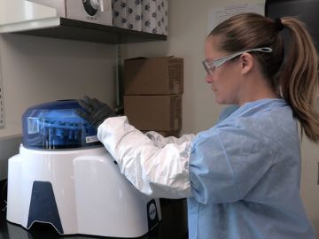 A person in a lab testing diagnostics