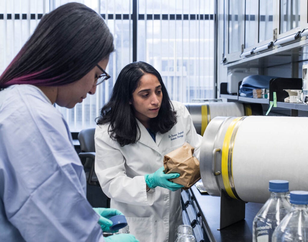 Two people standing in a lab.