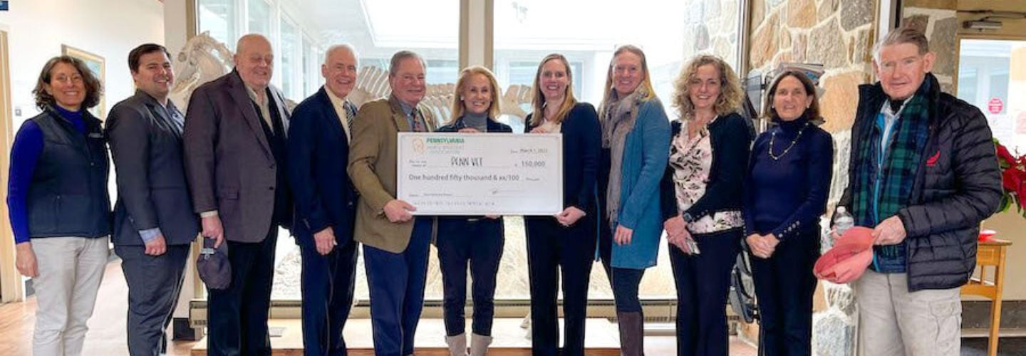 Members of the Pennsylvania Horse Breeders Association present a check to Dr. Mary Robinson (right of center) and other faculty at New Bolton Center.