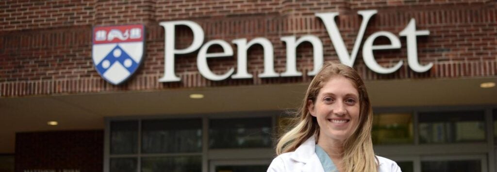 Woman standing in front of Penn Vet sign