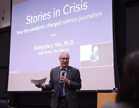 Dean speaking at symposium