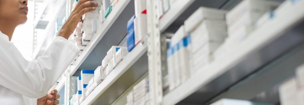 A person picking out medication.