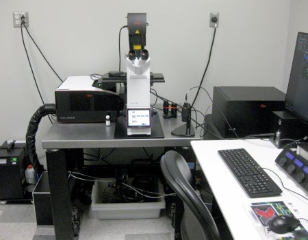 a desk with a computer, keyboard and mouse on it