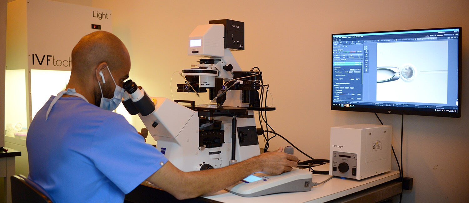 using a microscope at the lab