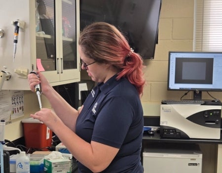 a person in a lab is working on something
