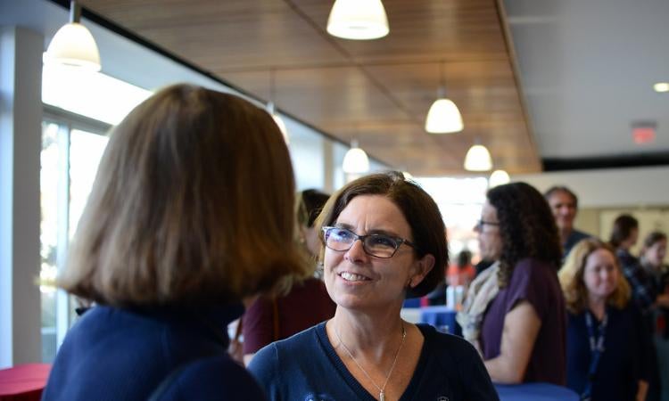 Two people talking at an event
