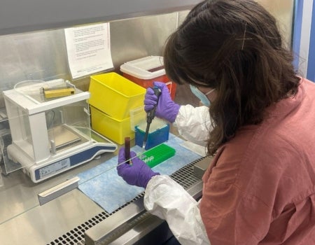 A person in a lab is working on something