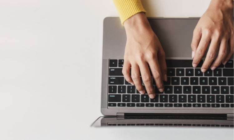 A person typing on a computer.